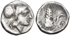 Greek Italy. Southern Lucania, Metapontum. AR Diobol, 325-275 BC. Obv. Helmeted head of Athena right. Rev. Ear of barley, leaf on the right side; to r...