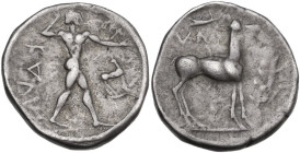 Greek Italy. Bruttium, Kaulonia. AR Stater, circa 475-425 BC. Obv. ΚΑVΛ (retrograde), Apollo, nude, his hair bound with a taenia, advancing to right, ...