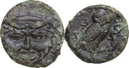 Sicily. Kamarina. AE Onkia, 425-405 BC. Obv. Gorgoneion. Rev. Owl standing right, head facing, wings closed, holding lizard; in exergue, one pellet. C...