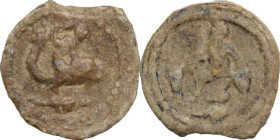 PB Tessera, Asia Minor, 2nd-3rd century AD. D/ Eros riding on dolphin right. R/ Seted figure left, flanked by urns. PB. 3.50 g. 16.50 mm. About VF/Goo...