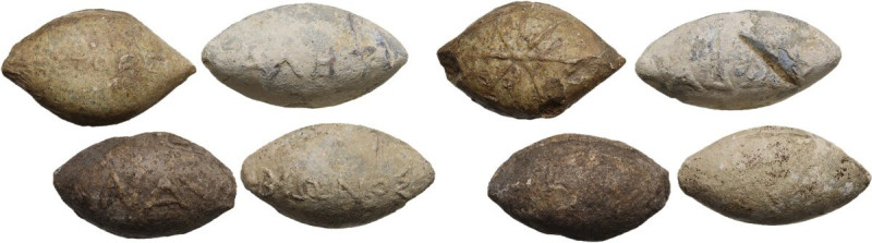 Lot of four lead slingshot bullets, (3) with inscription and (1) with sun.