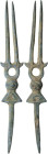 Bronze moulded fork. Geometric decoration resembling a very stylized bull's head. 109 mm.