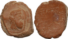 Clay seal with bearded male head right. Diameter: 18 mm.