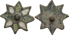 Bronze decorative element in the shape of flower with green and white glass paste inlaids. Barbaric-Late Roman period. 16 mm.