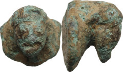 Bronze applique with head. Roman period. 18 x 18 mm.