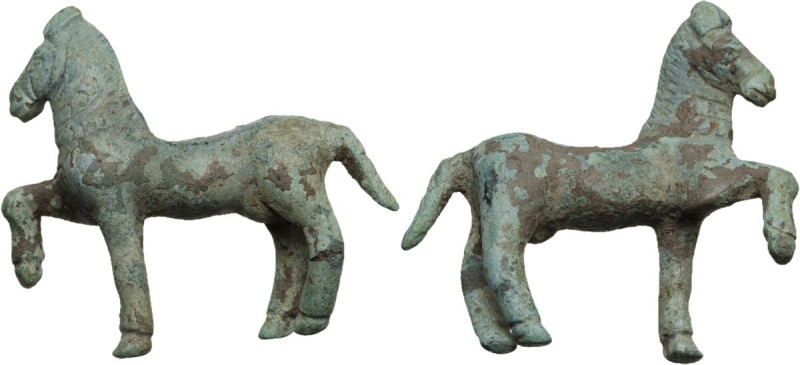 Bronze horse statuette, right foreleg raised. Engraved details and decoration. R...