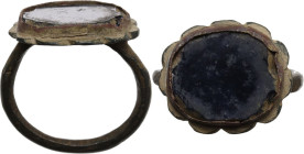 Bronze ring with large flat bezel with onyx inlay. Inner diameter: 18 mm.