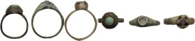 Lot of three bronze rings with glass inlays. Inner diameters: 17 mm, 17 mm and 15 mm.