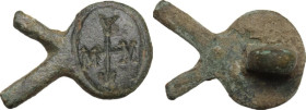 Bronze fragment of a brooch with engraved monogram. Byzantine. 19 x 12 mm.