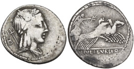 L. Julius Bursio. Denarius, 85 BC. Obv. Male head right, with the attributes of Apollo, Mercury and Neptune; behind, control-mark. Rev. Victory in qua...