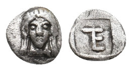 IONIA. Kolophon. (Circa 450-410 BC). AR Tetartemorion.
Obv: Facing head of Apollo with long hair.
Rev: TE monogram (mark of value) in incuse square....
