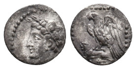 CILICIA. Uncertain. (4th century BC). AR Obol.
Obv: Head left, wearing wreath of grain ears
Rev: Eagle, with spread wings, standing left on the back...