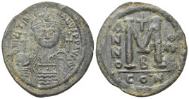 JUSTINIAN I, 527-565 AD. AE, Follis. Constantinople. 2nd officina.
Obv: D N IVSTINIANVS P P AVG.
Frontal bust of Justinian I with plumed helmet, dia...