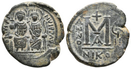 JUSTIN II, 565-578 AD. AE, Follis. Nicomedia. 1st officina. Dated RY 8 (572-573).
Obv: D N IVSTINVS P P AVC.
Justin II and Sophia nimbate and seated...