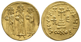 HERACLIUS, HERACLIUS CONSTANTINE and HERACLONAS, 610-641 AD. AV, Solidus. Constantinople.
Obv: Herakleios stands at center with mustache and long bea...