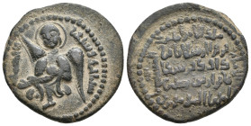 Islamic. Anatolia & al-Jazira (Post-Seljuk). Artuqids. NUR AL-DIN MUHAMMED, 1174-1185 AD / 570-581 AH. AE, Dirham.
Obv: Winged angel, aureolate, hold...