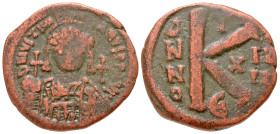 "Justinian I. 527-565. AE half follis (27.6 mm, 11.25 g, 7 h). Constantinople mint, Struck 540/1. D N IVSTINI-ANVS P P AVG, helmeted and cuirassed bus...