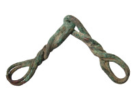 "A Cypriot bronze Snaffle Bit for a horse, ca. 1000 - 600 B.C. , part of the bridle gear and formed from twisted bronze wire joined at center. L: 8.25...