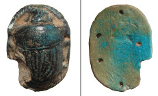 "An Egyptian faience pectoral scarab, Late Period - Ptolemaic, ca. 664 - 30 B.C. , with deep turquoise color and holes at either side for attachment o...