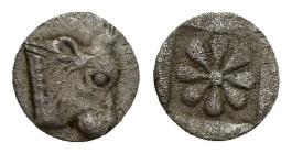 Western Asia Minor, uncertain mint AR Hemiobol(?).(6mm, 0.1 g) Circa 480-450 BC. Head of bull right / Stellate floral pattern within shallow incuse sq...