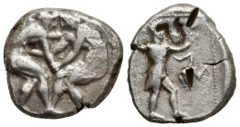 Pamphylia - Aspendos - Wrestlers Stater. (21mm, 11 g) 330-250 BC. Obv: two naked athletes, wrestling, grasping each other by the arms. Rev: Slinger ad...