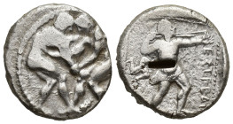 Pamphylia, Aspendos AR Stater. (21mm, 10.9 g) Circa 380-325 BC. Two wrestlers grappling / EΣTFEΔIIYΣ, slinger in throwing stance right; triskeles to l...