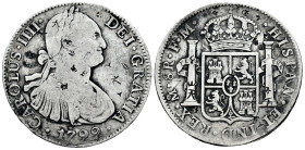 Charles IV (1788-1808). 8 reales. 1799. Mexico. FM. (Cal-963 var). Ag. 26,60 g. Chop marks. Choice F. Est...50,00. 

Spanish description: Carlos IV ...