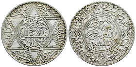 Morocoo. Abd Al-Aziz Al-Mansur. 1 rial. 1320 H (1902). London. (Km-22.1). Ag. 24,92 g. Choice VF. Est...40,00. 

Spanish description: Marruecos. Abd...
