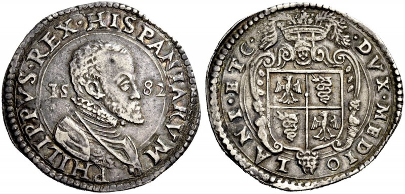 Milano. Scudo 1582, AR 31,82g. PHILIPPVS REX HISPANIARVM Busto corazzato a d.; a...