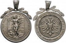 Donauwörth, Stadt. Tragbare, versilberte Bronzemedaille o.J. (um 1930) unsigniert, auf den Donaugau. Stadtwappen auf Kartusche / Hl. Sebastian auf Taf...