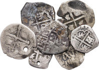 Lote de 7 monedas macuquinas en plata, cecas distintas, dos con perforación. A examinar. BC-/BC.