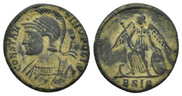 City Commemorative AD 330-346. Siscia Follis Æ (17mm, 2,6 g). CONSTANTINOPOLIS, laureate, and helmeted bust left, wearing imperial mantle and holding ...