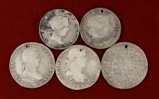 Lote de 5 monedas en plata, con perforación (4 reales de Felipe V y Fernando VII, 50 centavos y 1 escudo de Isabel II). A examinar. (BC-/MBC-).