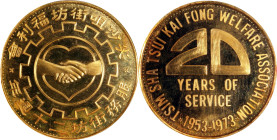HONG KONG. Tsim Sha Tsui Kaifong Welfare Association 20th Anniversary Gold Medal, 1973. PCGS MS-67.
Featuring two clasped hands over the outline of a...