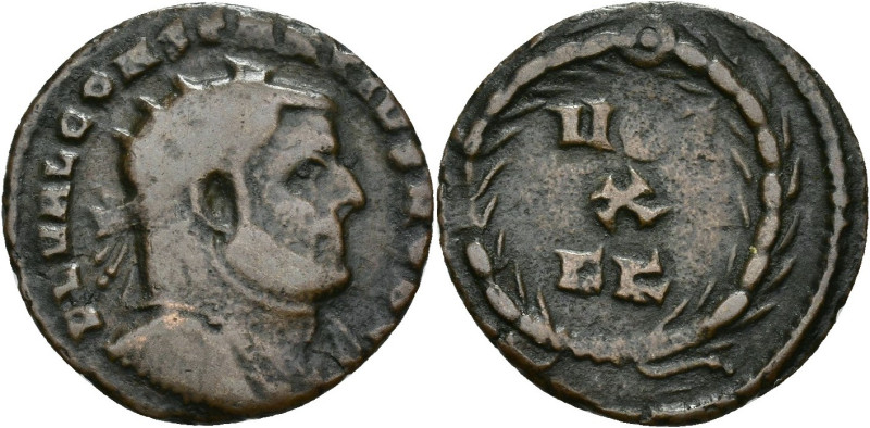 IMPERIO ROMANO. CONSTANCIO I. Follis fraccional. Cartago (303). R/ Corona rodean...