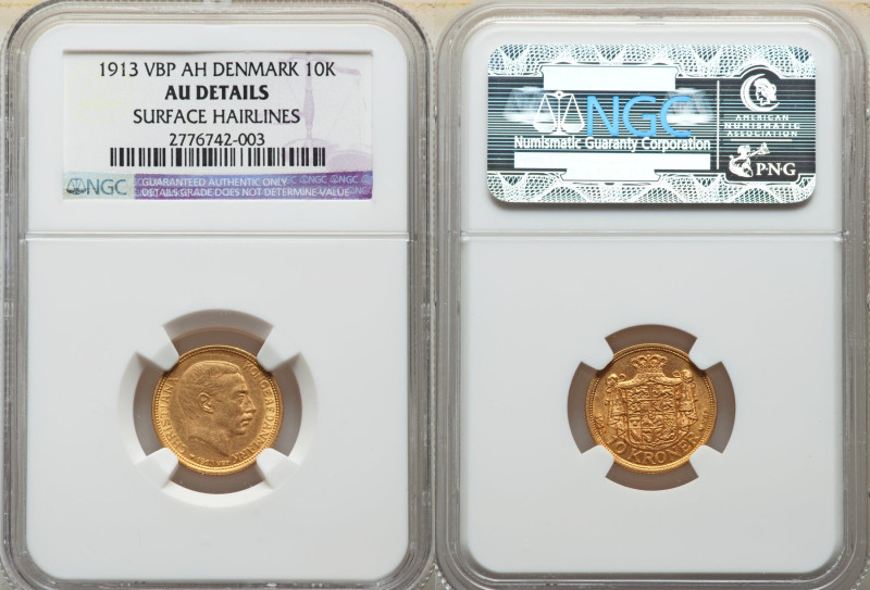 Christian X gold 10 Kroner 1913-VBP AU Details (Surface Hairlines) NGC, KM816. 
...