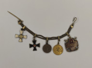 Tailcoat medal bar for five awards on a chain. Russian Empire (Western Europe?), last quarter of the 19th century. Private workshop.
1. Sign of the O...