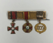 Tailcoat medal bar for three awards on the clasp.
Russian Empire (Western Europe?), last third of the 19th century. Private workshop. 1. Order of St....
