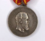 Medal "For Zeal" with a portrait of Emperor Alexander III. On the Order of St. Anne ribbon. 
On the ribbon of St. Anne (150 x 28 mm). Engraver: A. Gr...