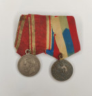 Medal bar with two awards.
1. Medal "For Zeal" with a portrait of Emperor Nicholas II. Russian Empire, late XIX - early XX century. Unknown workshop....