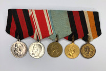 Medal bar with five awards.
1. Medal "For life saving" with a portrait of Emperor Nicholas II. Russian Empire. St. Petersburg Mint, 1904–1915. Medali...