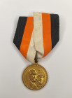 Medal "In Commemoration of the 300th Anniversary of the Reign of the House of Romanov 1613-1913", Emperor Nicholas II with an order. With a ribbon of ...