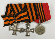 Medal bar with two Military Orders of St. George Insignias and a medal.
1. Insignia of the Military Order of St. George 3rd class, No. 10638. Russian...