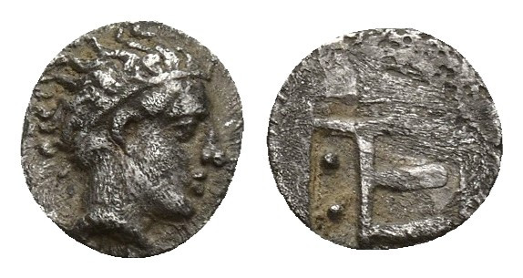 IONIA. Kolophon. AR Tetartemorion (6.8mm, 0.2 g), c. 450-410 BC. Obv, Laureate h...