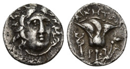 Island of Caria. Rhodes, c. 188-170 BC. AR Drachm (14mm, 2.6 g). Rhodian or Cretan mint. Ainetor, magistrate. Radiate head of Helios facing slightly r...