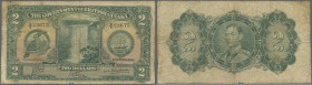 British Guiana: 2 Dollars 1938 P. 13b, seldom seen note in used condition, with several folds and stained paper, no holes, a tiny missing part at lowe...