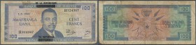 Burundi: 100 Francs 1965 with black overprint ”De La Republique” P. 17 in used condition with folds and stain in paper, condition: F.