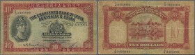 Hong Kong: 10 Dollars 1954 P. 55, stronger used with very strong horizontal and vertical fold, center tear, worn borders, still nice colors and no rep...