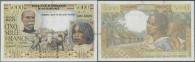 Madagascar: 5000 Francs 1955 P. 55, used with folds and pinholes, 2 very tiny and restored tears at upper border and one at right, still strongness in...