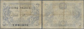 Tunisia: 5 Francs 1920 Algeria with black overprint Tunisia P. 1, used with stronger folds, stain, center hole, border tears, no repairs, condition: F...